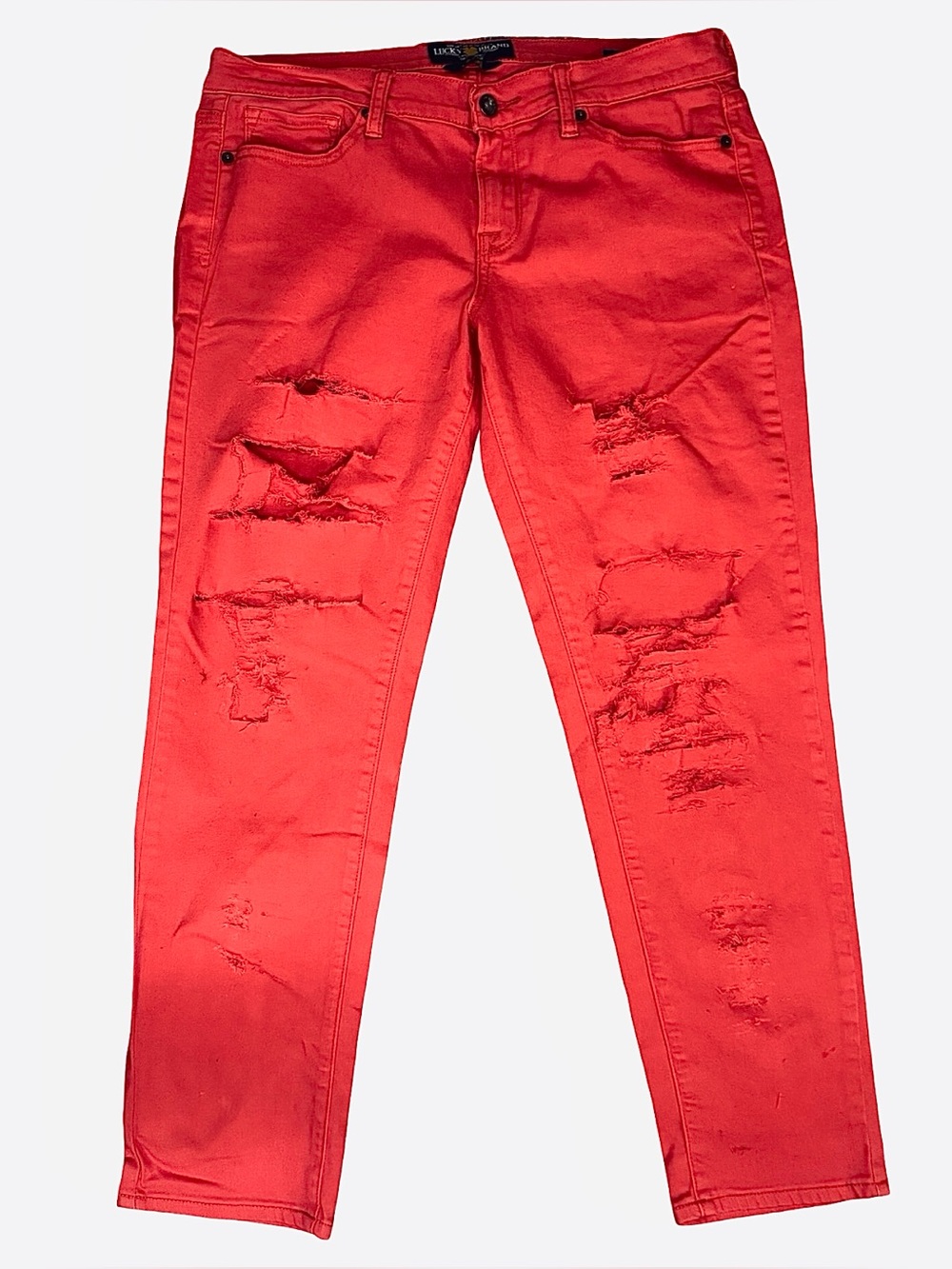 Red distressed skinny jeans
